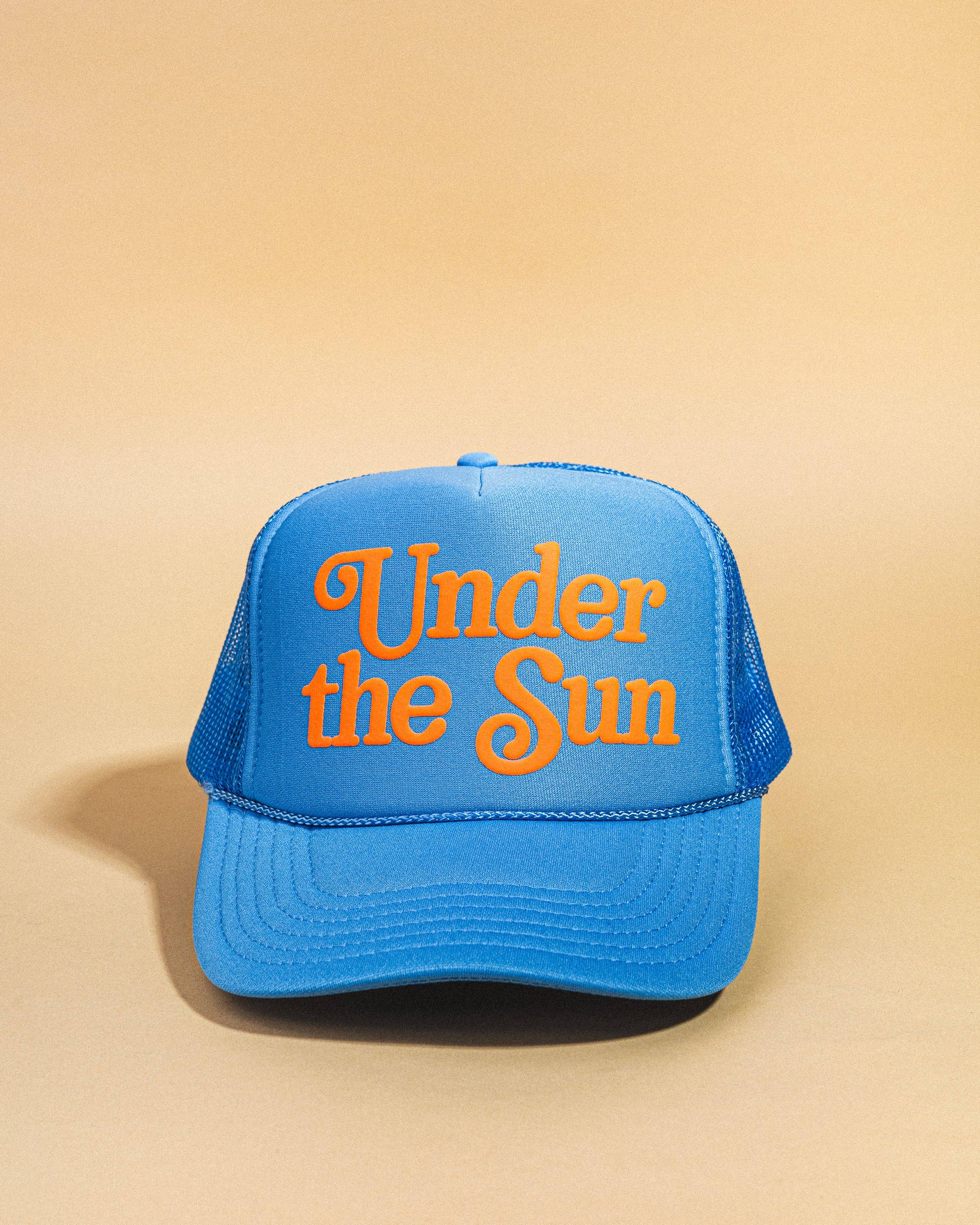 Blue trucker hat with Under the Sun text